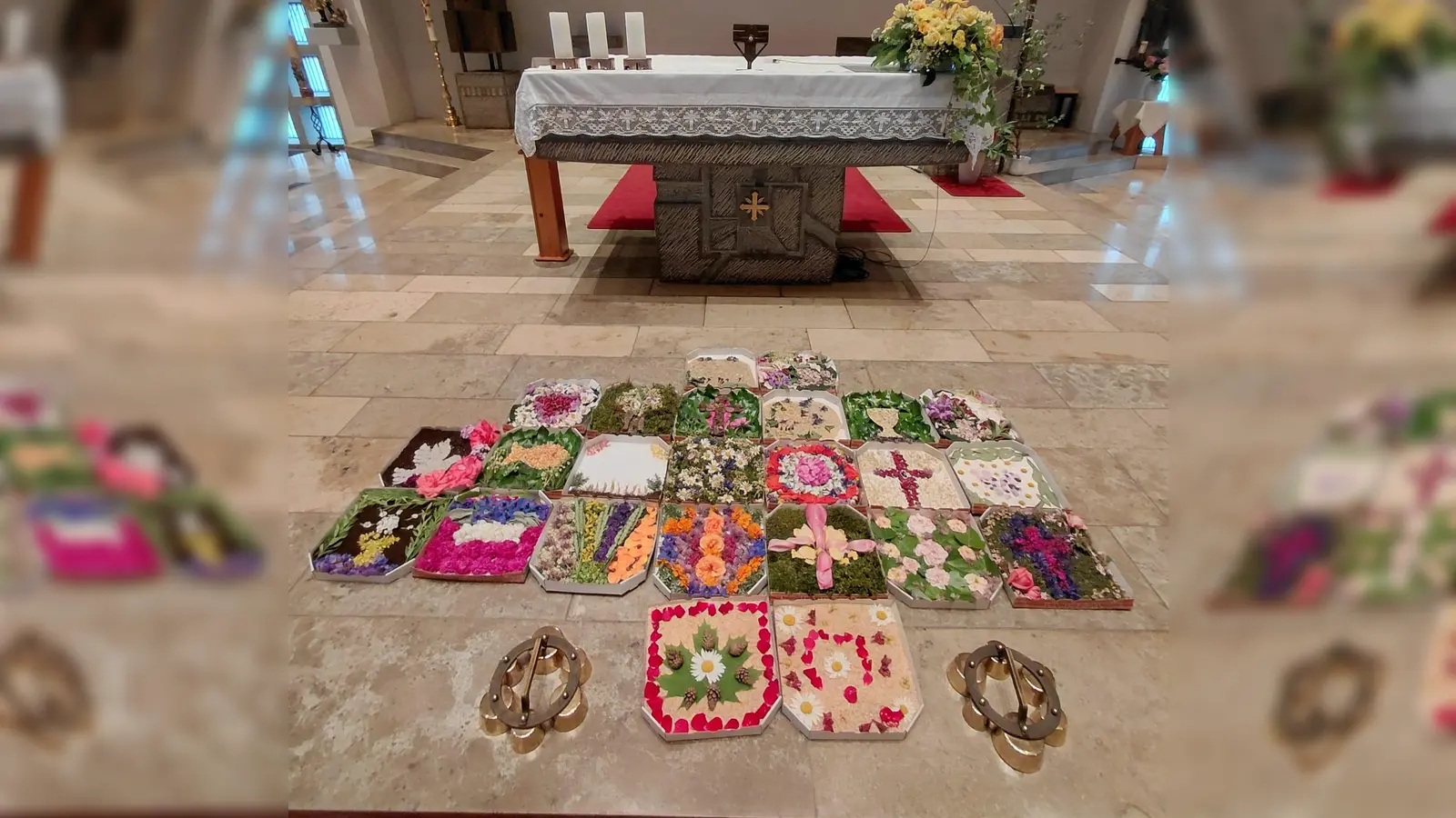 Der große Blumenteppich in der Kirche Mariä Himmelfahrt, gestaltet mit den kleinen Blumenteppichen in den Pizzakartons. (Bild: Renate Schmidt)