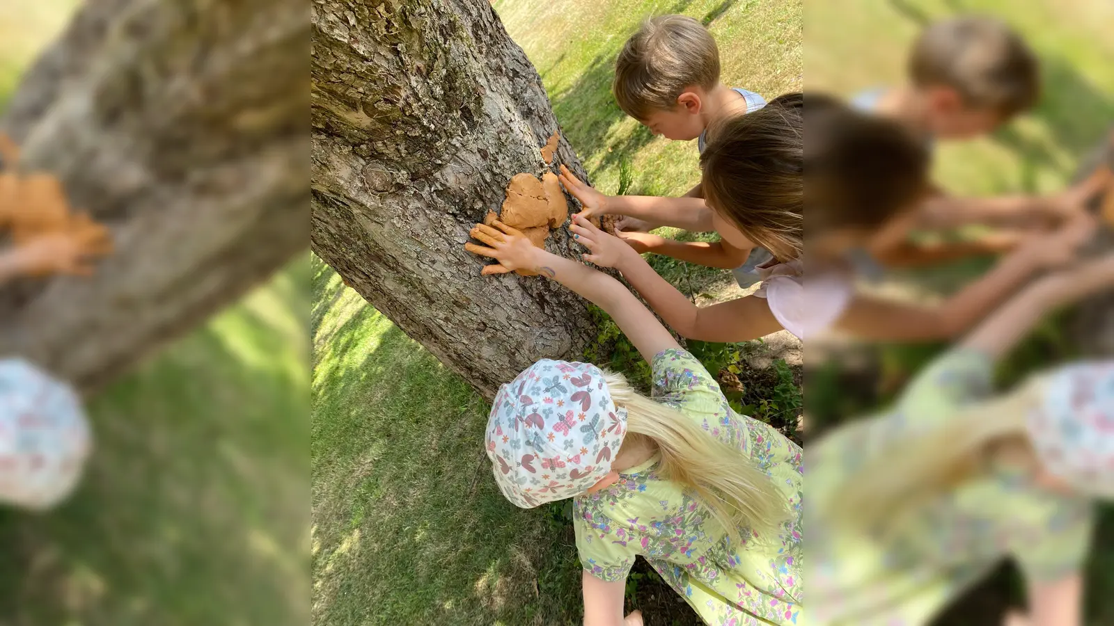 Mit weichem Lehm werden die Büme der Streuobswiese Unterweisenbach dekoriert. (Bild: Monika Krieger)